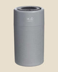 Grey NovaPulse AuraMist fragrance diffuser with minimalist texture and soft LED lighting