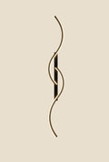 Minimalist NovaPulse AuraWave wall light with a rippled aluminium shape and diffuser emitting warm light