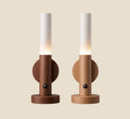 Two NovaPulse motion sensor lights in walnut and light wood, with warm LED lighting