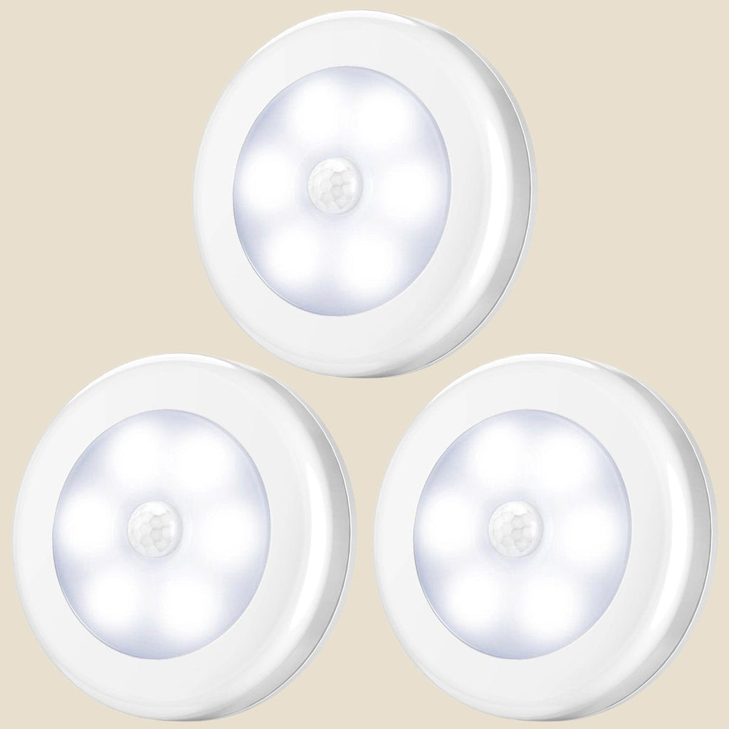 Three round white NovaPulse infrared motion-sensor lights for cupboards and wardrobes