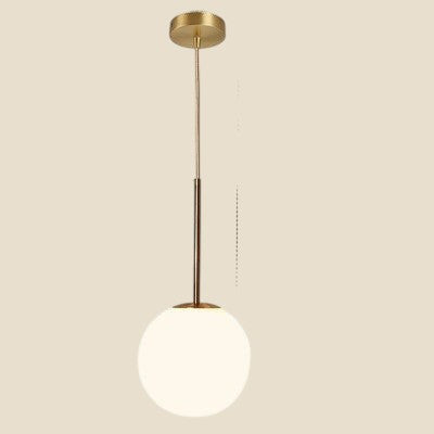 Lampa wisząca NovaPulse NordicOrb z miedzianym wykończeniem i szklanym kloszem w kształcie kuli
