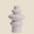 NovaPulse modern ceramic vase with a beige sculptural shape and matte finish