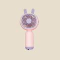 NovaPulse kawaii-style handheld fan with rabbit ears in pastel pink and purple