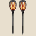 Two black NovaPulse solar garden lights with LED flame effect, waterproof design and ground stakes