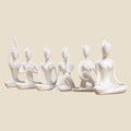 Set of six white NovaPulse ceramic and resin yoga figurines in different meditation poses