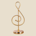 Gold NovaPulse LED night light shaped like a treble clef, with dimming function